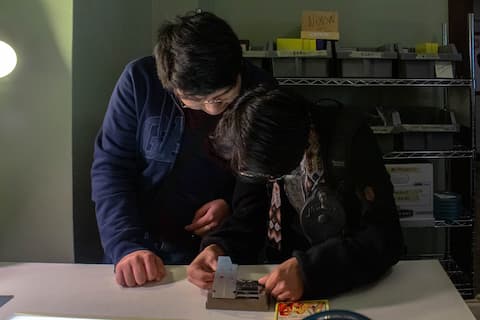 Students cutting Super 8 film.